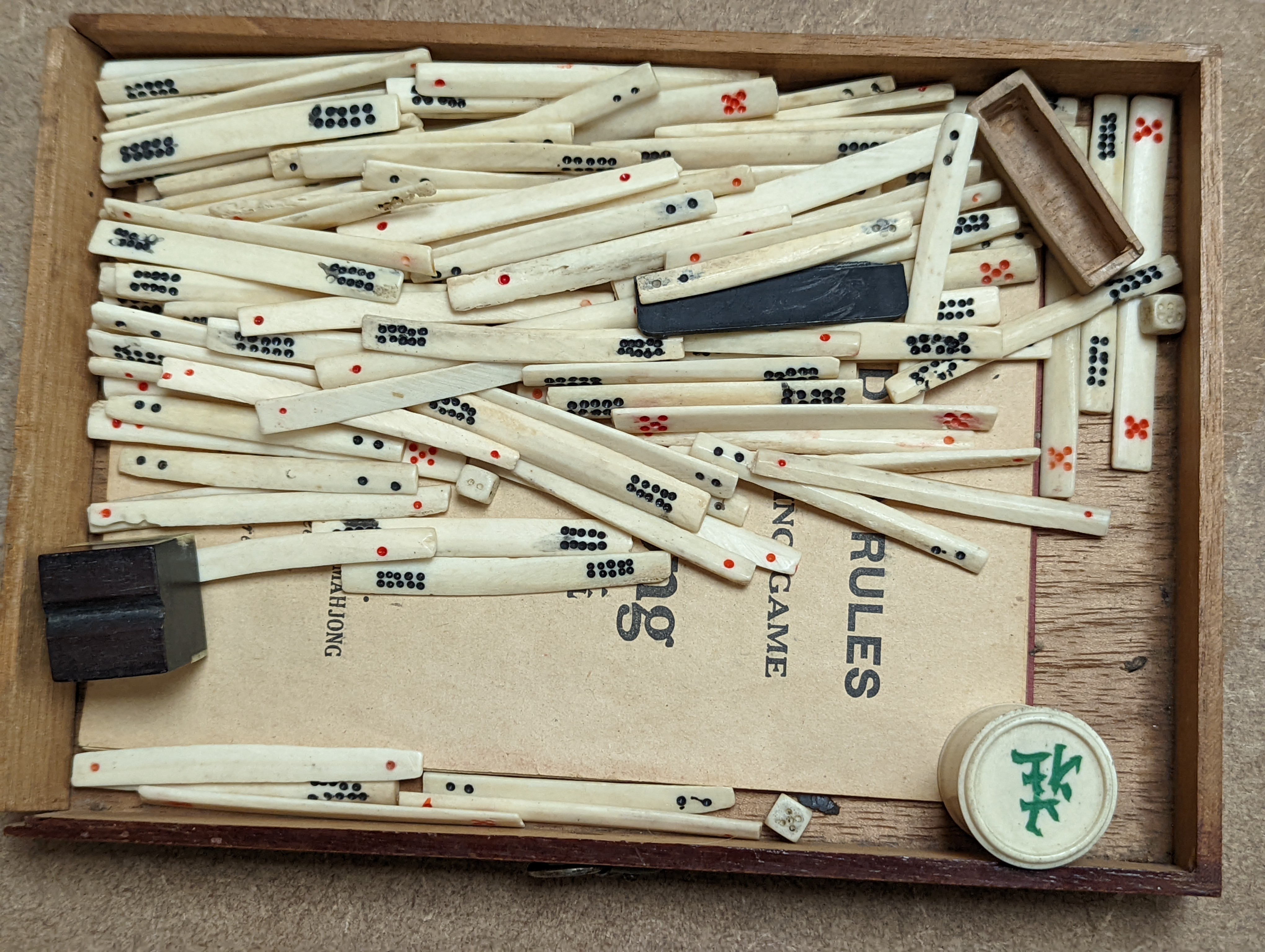 A Mah Jong set in wooden box, 17 cms high.